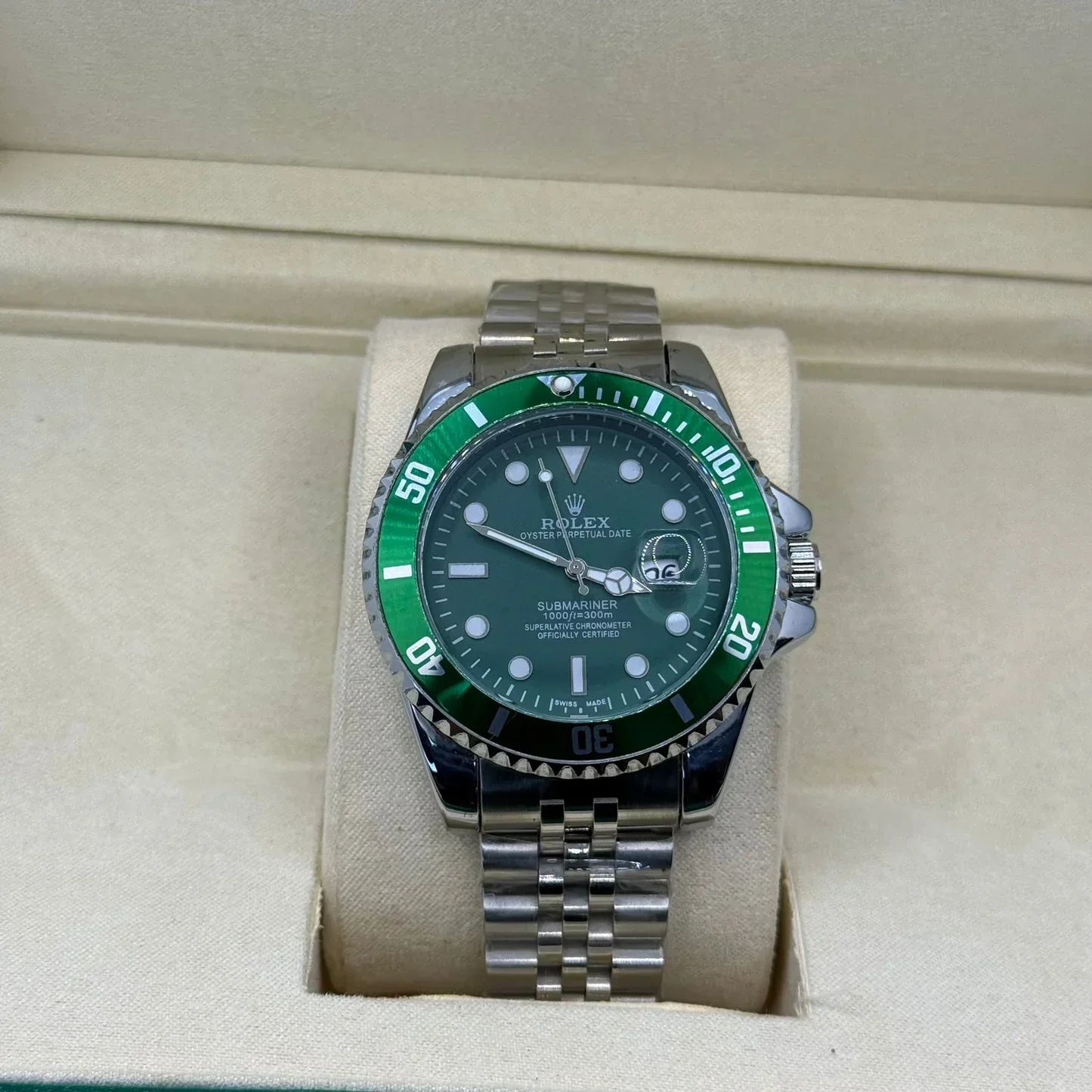Rolex submariner silver with green rotating dial with date