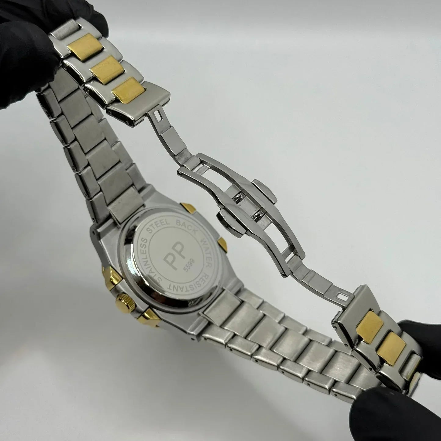 PP Gold with black dial with date