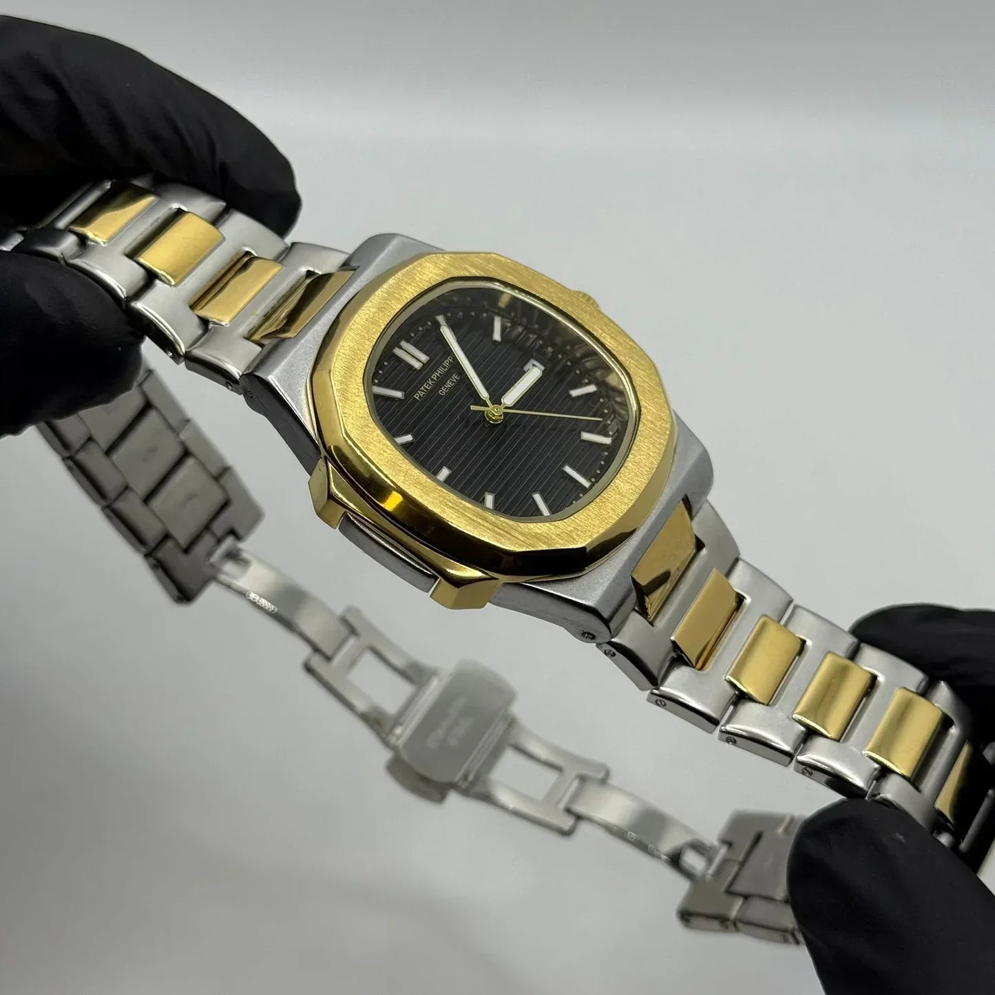 PP Gold with black dial with date